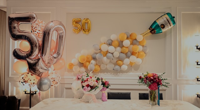 yellow and white balloons on table